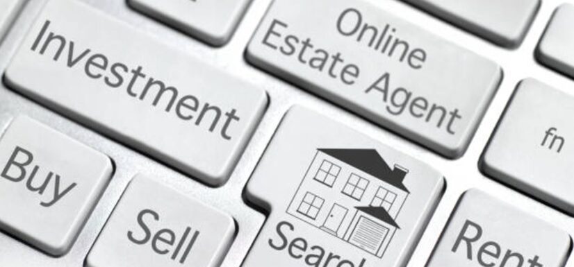 Tecaldo de computadora con el botón de "Enter" con el ícono de una casita y un letrero que dice "Search" y el marco de Inmobiliaria KIAFRA
